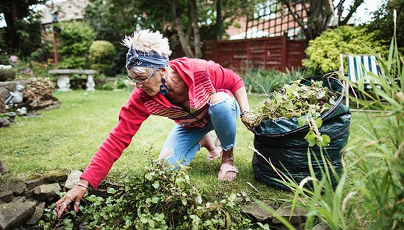 A woman doing resistance training by gardening